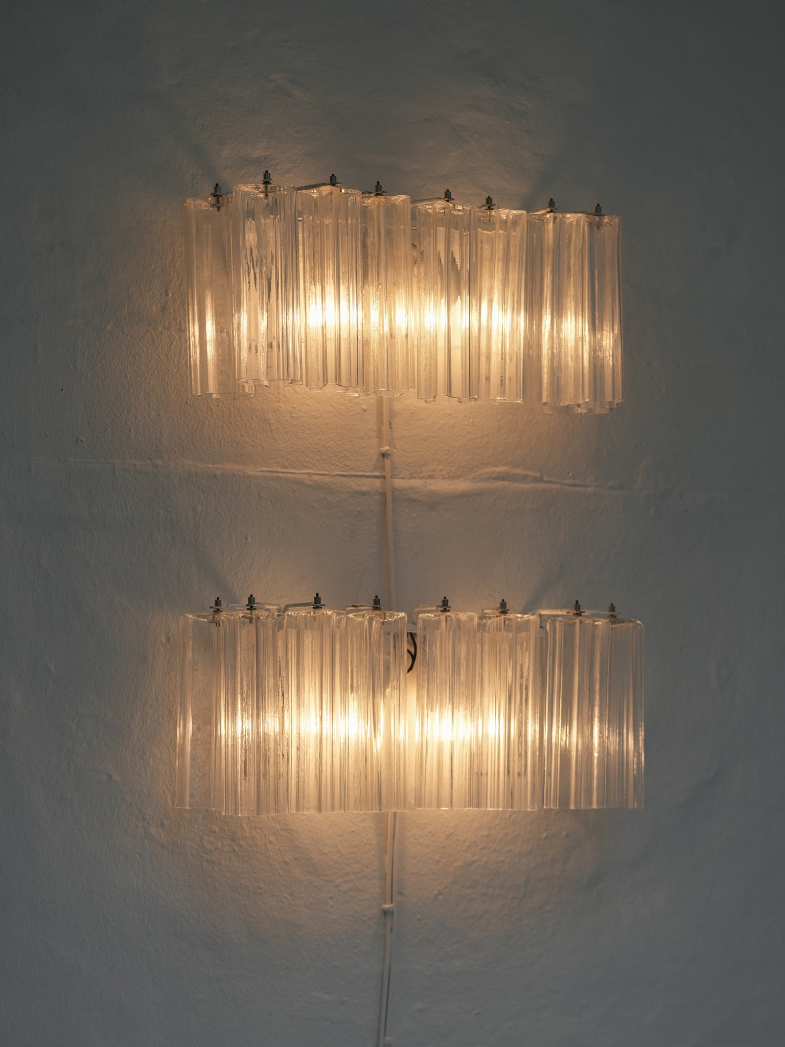 Pair of vintage Venini wall lights in clear Murano glass with a metal frame, crafted in Italy, 1960s. Available at RUE VERTE, Copenhagen's destination for vintage and contemporary art, lighting and furniture.