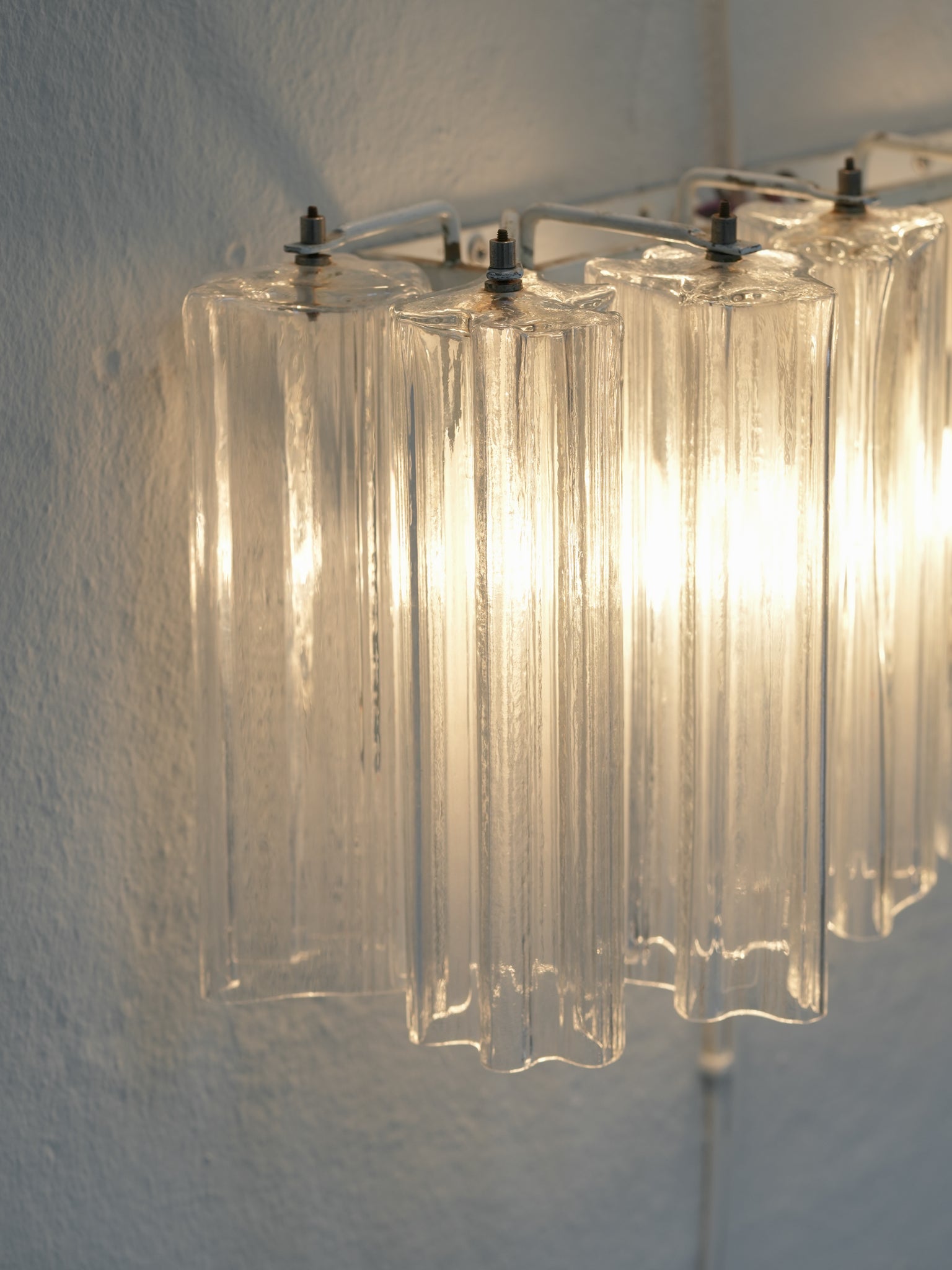 Pair of vintage Venini wall lights in clear Murano glass with a metal frame, crafted in Italy, 1960s. Available at RUE VERTE, Copenhagen's destination for vintage and contemporary art, lighting and furniture.